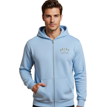 Man wearing a light blue hoodie with a brand logo DGLOX